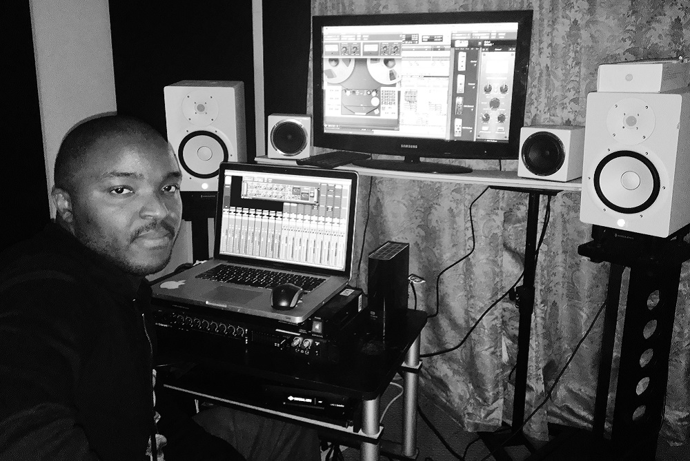 Oluyomi Osh using music production gear at home